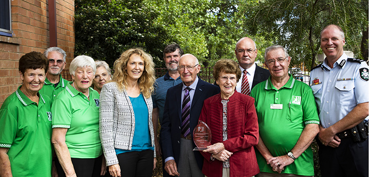 Neightbourhood Watch ACT members congratulate Margaret and Mick Dando, winners of the Good Neighbour Award for 2019